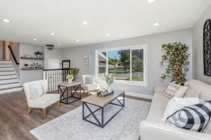 Stylish living area featuring cozy seating, large window views, and contemporary home décor.